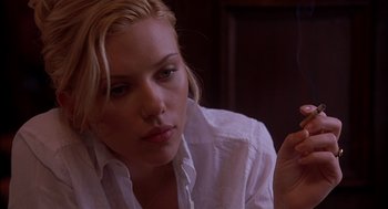 Movie still from “Match Point” (2005), directed by Woody Allen – A person wearing a white shirt; Close Up shot, Over the shoulder angle