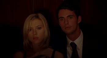 Movie still from “Match Point” (2005), directed by Woody Allen – A man and a woman posing for a picture; Close Up shot, Low angle