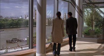 Movie still from “Match Point” (2005), directed by Woody Allen – A man and a woman are looking out a window; Wide shot, Low angle