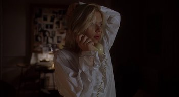 Movie still from “Match Point” (2005), directed by Woody Allen – A woman holding a phone up to her head; Close Up shot, Low angle