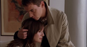 Movie still from “Match Point” (2005), directed by Woody Allen – A man and a woman are hugging and looking into each others eyes; Close Up shot, Low angle