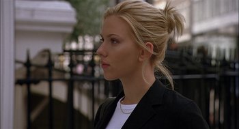 Movie still from “Match Point” (2005), directed by Woody Allen – A woman in a black jacket is looking to her left; Close Up shot, Low angle