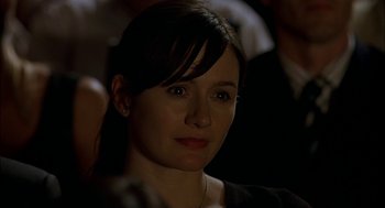 Movie still from “Match Point” (2005), directed by Woody Allen – A person wearing a black shirt; Close Up shot, Over the shoulder angle