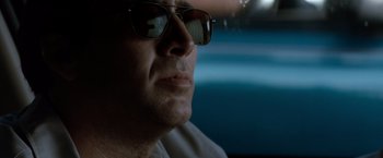 Movie still from “Matchstick Men” (2003), directed by Ridley Scott – A person wearing sunglasses; Close Up shot, Low angle