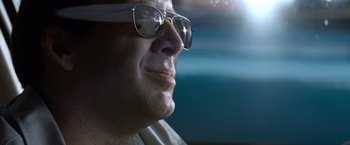 Movie still from “Matchstick Men” (2003), directed by Ridley Scott – A person wearing glasses; Extreme Close Up shot, Low angle