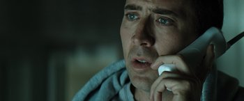 Movie still from “Matchstick Men” (2003), directed by Ridley Scott – A person talking on a cell phone; Close Up shot, Low angle