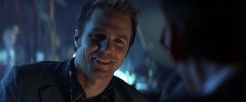 Movie still from “Matchstick Men” (2003), directed by Ridley Scott – A person smiling at the camera; Close Up shot, Over the shoulder angle