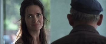 Movie still from “Matchstick Men” (2003), directed by Ridley Scott – A person smiling at the camera; Close Up shot, Over the shoulder angle