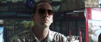 Movie still from “Matchstick Men” (2003), directed by Ridley Scott – A person wearing sunglasses; Close Up shot, Low angle