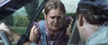 Movie still from “Matchstick Men” (2003), directed by Ridley Scott – A young girl crying in the back of a car; Close Up shot, Over the shoulder angle