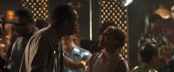 Movie still from “Matchstick Men” (2003), directed by Ridley Scott – A man and a woman laughing together in a room; Close Up shot, Low angle