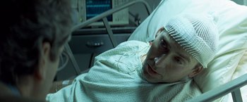 Movie still from “Matchstick Men” (2003), directed by Ridley Scott – A man in a hospital bed with a bandage on his head; Close Up shot, High angle