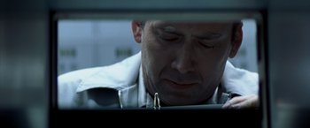 Movie still from “Matchstick Men” (2003), directed by Ridley Scott – A person looking at a computer screen; Extreme Close Up shot, Low angle