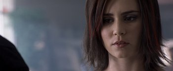 Movie still from “Matchstick Men” (2003), directed by Ridley Scott – A woman's face with red hair; Close Up shot, Over the shoulder angle