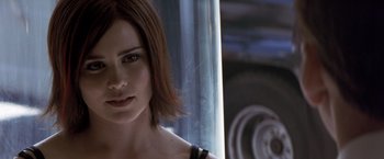 Movie still from “Matchstick Men” (2003), directed by Ridley Scott – A person with short red hair; Close Up shot, Over the shoulder angle