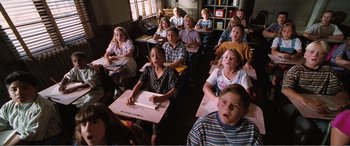 Movie still from “Matilda” (1996), directed by Danny DeVito – A group of children sitting at desks in a classroom; Medium shot, High angle