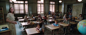Movie still from “Matilda” (1996), directed by Danny DeVito – A group of children sitting at desks in a classroom; Wide shot, High angle