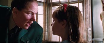 Movie still from “Matilda” (1996), directed by Danny DeVito – A man and a little girl talking to each other; Close Up shot, Over the shoulder angle