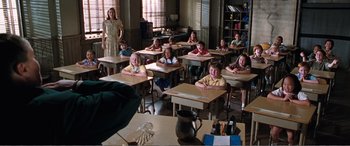 Movie still from “Matilda” (1996), directed by Danny DeVito – A group of children sitting at desks in a classroom; Medium shot, High angle