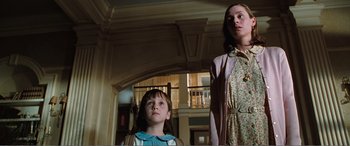 Movie still from “Matilda” (1996), directed by Danny DeVito – Two young girls standing in a room looking up at the ceiling; Medium shot, Low angle