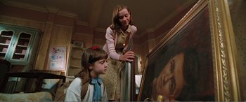 Movie still from “Matilda” (1996), directed by Danny DeVito – A woman and a little girl looking at a painting; Medium shot, Low angle