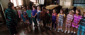 Movie still from “Matilda” (1996), directed by Danny DeVito – A group of children standing next to each other in a room; Wide shot, High angle