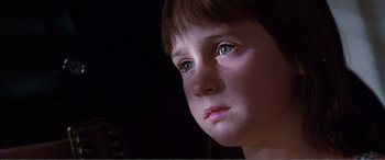 Movie still from “Matilda” (1996), directed by Danny DeVito – A child's face in the dark; Close Up shot, Low angle
