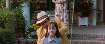 Movie still from “Matilda” (1996), directed by Danny DeVito – A man and a little girl sitting on a porch; Medium shot, Over the shoulder angle