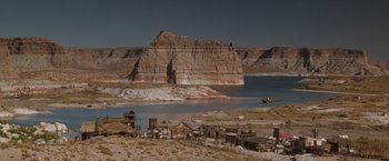 Movie still from “Maverick” (1994), directed by Richard Donner – A view of a lake with a mountain in the background; Extreme Wide shot, High angle