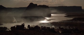 Movie still from “Maverick” (1994), directed by Richard Donner – A large body of water near a mountain; Extreme Wide shot, Low angle