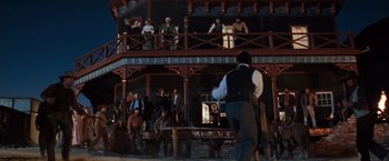 Movie still from “Maverick” (1994), directed by Richard Donner – A crowd of people standing on a balcony; Wide shot, Low angle