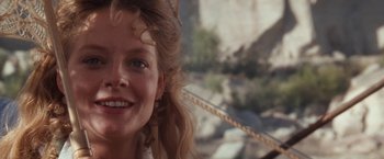 Movie still from “Maverick” (1994), directed by Richard Donner – A woman smiling for the camera; Close Up shot, Low angle