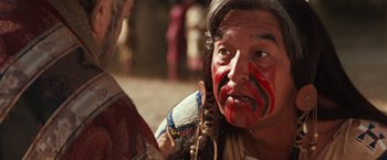 Movie still from “Maverick” (1994), directed by Richard Donner – A man with face paint talking to another man; Close Up shot, Over the shoulder angle