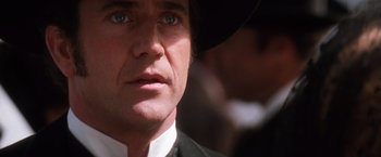 Movie still from “Maverick” (1994), directed by Richard Donner – A man wearing a hat; Close Up shot, Over the shoulder angle