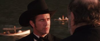 Movie still from “Maverick” (1994), directed by Richard Donner – A man wearing a cowboy hat; Close Up shot, Over the shoulder angle