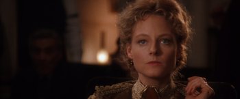 Movie still from “Maverick” (1994), directed by Richard Donner – A person wearing a suit and tie; Close Up shot, Over the shoulder angle