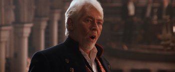 Movie still from “Maverick” (1994), directed by Richard Donner – An older man with white hair wearing a black jacket; Close Up shot, Low angle