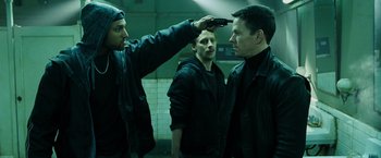 Movie still from “Max Payne” (2008), directed by John Moore – Two men in black jackets and one man in a black jacket; Medium shot, Low angle