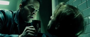 Movie still from “Max Payne” (2008), directed by John Moore – A man looking at himself in the mirror; Close Up shot, Over the shoulder angle