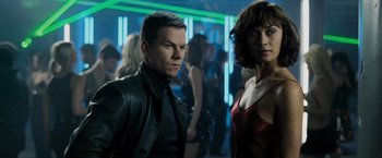 Movie still from “Max Payne” (2008), directed by John Moore – A man and a woman standing next to each other in a room; Close Up shot, Low angle