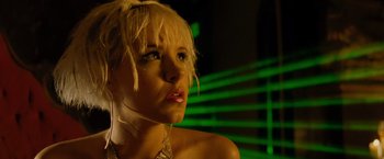 Movie still from “Max Payne” (2008), directed by John Moore – A woman with blonde hair and a necklace; Close Up shot, Low angle