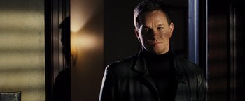 Movie still from “Max Payne” (2008), directed by John Moore – A person wearing a jacket; Close Up shot, Over the shoulder angle