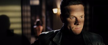 Movie still from “Max Payne” (2008), directed by John Moore – A person wearing a leather jacket; Close Up shot, Low angle