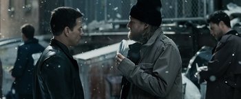 Movie still from “Max Payne” (2008), directed by John Moore – Two men standing next to each other on a snowy day; Close Up shot, Over the shoulder angle