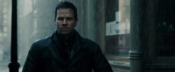 Movie still from “Max Payne” (2008), directed by John Moore – A person wearing a black jacket; Close Up shot, Low angle