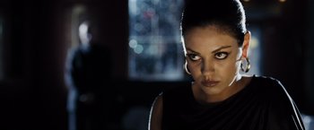 Movie still from “Max Payne” (2008), directed by John Moore – A person wearing a black shirt; Close Up shot, Over the shoulder angle