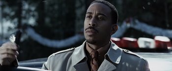 Movie still from “Max Payne” (2008), directed by John Moore – A person wearing a jacket and a tie; Close Up shot, Over the shoulder angle