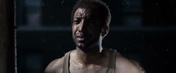 Movie still from “Max Payne” (2008), directed by John Moore – A person with sweat on his face; Close Up shot, High angle