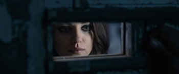 Movie still from “Max Payne” (2008), directed by John Moore – A person's face in a mirror; Close Up shot, Over the shoulder angle