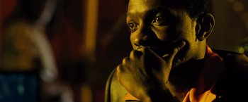 Movie still from “Max Payne” (2008), directed by John Moore – A person holding his hand to his face; Close Up shot, High angle